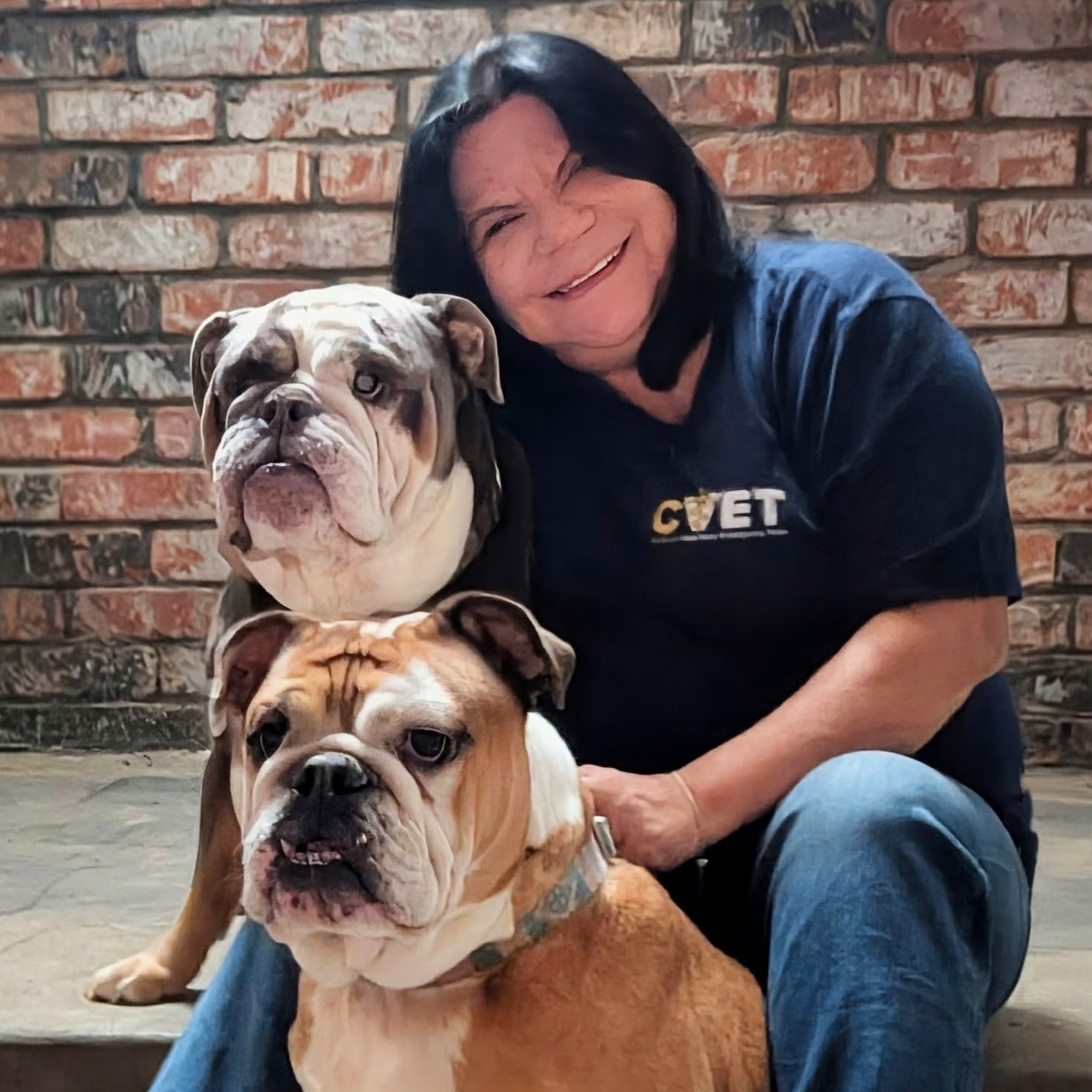 Ruby Sandoval with her two bulldogs