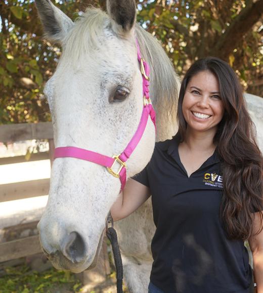 Briana Hamamoto with a grey horse