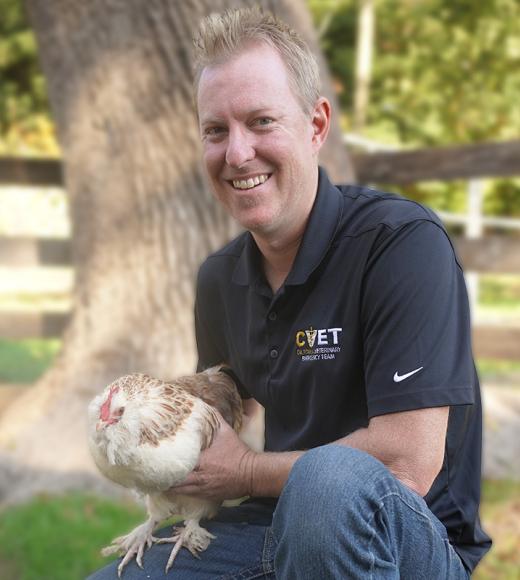 Jon Weststeyn holding a chicken