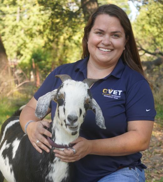 Kim Carlson holding a goat
