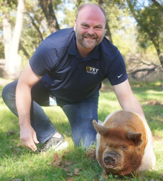 Scott Buhl with a pig