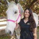 Briana Hamamoto with a grey horse