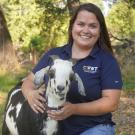 Kim Carlson holding a goat