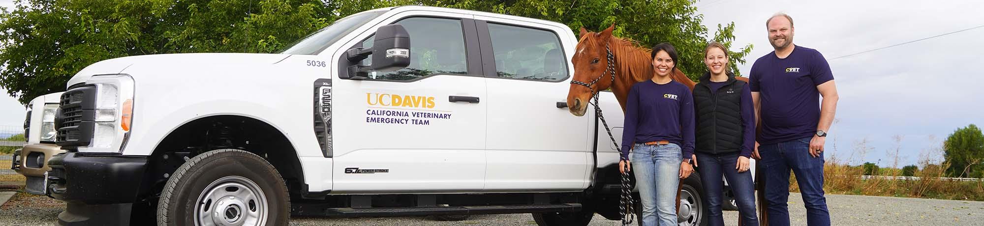 CVET managment team members standing in front of vehicle
